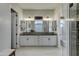 Bathroom featuring double sinks, a spacious vanity, and walk-in shower with glass door at 4053 E Zion Way, Chandler, AZ 85249