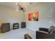 Cozy sitting room with a vintage record player, speakers, abstract wall art and unique light fixture at 4053 E Zion Way, Chandler, AZ 85249