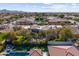 Aerial view showcasing a large home with a pool and surrounding landscape at 4330 E Gemini Pl, Chandler, AZ 85249