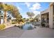 Relaxing kidney-shaped pool with waterfall feature in a spacious backyard at 4330 E Gemini Pl, Chandler, AZ 85249