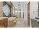 Spa-like bathroom featuring a soaking tub, double sinks, and glass block accents at 4330 E Gemini Pl, Chandler, AZ 85249