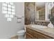 Bathroom with tile shower, vanity, and stone accents at 4330 E Gemini Pl, Chandler, AZ 85249