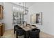 Bright dining room featuring a large window and modern table at 4330 E Gemini Pl, Chandler, AZ 85249