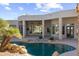 Inviting kidney-shaped pool with a waterfall feature and spacious patio at 4330 E Gemini Pl, Chandler, AZ 85249