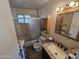 Bathroom with shower/tub combo and granite countertop at 4411 N 56Th Dr, Phoenix, AZ 85031