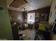 Bedroom with wood paneling, shelving, and ceiling fan at 4411 N 56Th Dr, Phoenix, AZ 85031