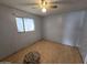 Small bedroom with wood flooring and a ceiling fan at 4411 N 56Th Dr, Phoenix, AZ 85031