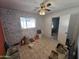 A bedroom with tiled floor and blue patterned walls at 4411 N 56Th Dr, Phoenix, AZ 85031