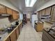 Kitchen with wood cabinets and double sink at 4411 N 56Th Dr, Phoenix, AZ 85031