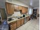 Kitchen with wood cabinets and stainless steel dishwasher at 4411 N 56Th Dr, Phoenix, AZ 85031