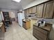 Kitchen with wood cabinets and refrigerator at 4411 N 56Th Dr, Phoenix, AZ 85031