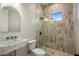 Modern bathroom with a walk-in shower, stylish vanity, and contemporary fixtures at 4420 E Glenrosa Ave, Phoenix, AZ 85018