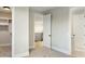 Neutral bedroom with carpet, a walk-in closet, and bright hallway view creating an open, airy atmosphere at 4420 E Glenrosa Ave, Phoenix, AZ 85018