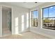 Light-filled bedroom with two large windows and access to a private bathroom, offering comfort and privacy at 4420 E Glenrosa Ave, Phoenix, AZ 85018