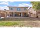 Home's backyard has a covered patio and grassy area at 45354 W Horse Mesa Rd, Maricopa, AZ 85139