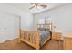 Bedroom with wood bed frame and ceiling fan at 45354 W Horse Mesa Rd, Maricopa, AZ 85139