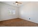 Simple bedroom with carpet and a ceiling fan at 45354 W Horse Mesa Rd, Maricopa, AZ 85139