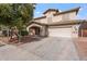 Two-story house with a large driveway and landscaped front yard at 45354 W Horse Mesa Rd, Maricopa, AZ 85139