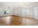 Bright living room with wood-look floors and bay window at 45354 W Horse Mesa Rd, Maricopa, AZ 85139