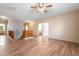 Upstairs hallway with wood-look floors and access to bedrooms at 45354 W Horse Mesa Rd, Maricopa, AZ 85139