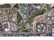 Aerial view of the property showcasing the surrounding neighborhood, golf course and tennis courts at 4575 N Phoenician Blvd # 2, Scottsdale, AZ 85251