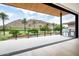Inviting balcony features a built-in grill and stunning views of the golf course and mountains at 4575 N Phoenician Blvd # 2, Scottsdale, AZ 85251