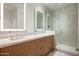 Bright bathroom featuring double vanity, wood cabinets and glass enclosed shower at 4575 N Phoenician Blvd # 2, Scottsdale, AZ 85251