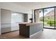 Stylish kitchen with golf course views, a large island, and modern cabinets at 4575 N Phoenician Blvd # 2, Scottsdale, AZ 85251