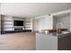 Bright living room with built-in shelving, fireplace, and kitchen island at 4575 N Phoenician Blvd # 2, Scottsdale, AZ 85251