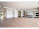 Spacious open-concept living area with hardwood floors and contemporary kitchen at 4575 N Phoenician Blvd # 2, Scottsdale, AZ 85251