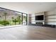 Stylish living area with a fireplace, built-ins, and sliding glass doors to the outdoors at 4575 N Phoenician Blvd # 2, Scottsdale, AZ 85251