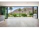 Bright living space with kitchen island, golf course views, and outdoor grill at 4575 N Phoenician Blvd # 2, Scottsdale, AZ 85251