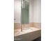 Modern bathroom featuring a sleek sink, stone countertop, and stylish light fixture at 4575 N Phoenician Blvd # 4, Scottsdale, AZ 85251