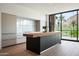 Bright, modern kitchen boasts sleek cabinetry, a center island and mountain views through the large windows at 4575 N Phoenician Blvd # 4, Scottsdale, AZ 85251
