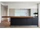 Sleek modern kitchen with white cabinets, center island, and stainless steel appliances at 4575 N Phoenician Blvd # 4, Scottsdale, AZ 85251