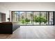Modern kitchen features a sleek island, hardwood flooring, and large windows with mountain views at 4575 N Phoenician Blvd # 4, Scottsdale, AZ 85251