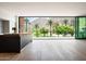 Modern kitchen features a sleek island, hardwood flooring, and large windows with mountain views at 4575 N Phoenician Blvd # 4, Scottsdale, AZ 85251