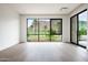 Bright living room with hardwood floors and a picturesque view of the golf course and mountains at 4575 N Phoenician Blvd # 4, Scottsdale, AZ 85251