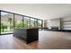 Bright open concept living space featuring floor to ceiling windows, fireplace and sleek island at 4575 N Phoenician Blvd # 4, Scottsdale, AZ 85251