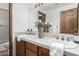 Double vanity bathroom with dark wood cabinets at 4920 E Beryl Ave, Paradise Valley, AZ 85253