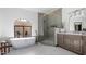 Modern bathroom with soaking tub, glass shower, and marble floors at 4920 E Beryl Ave, Paradise Valley, AZ 85253