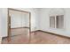 Bedroom with mirrored closet doors and wood floors at 4920 E Beryl Ave, Paradise Valley, AZ 85253