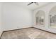 Bright bedroom with plantation shutters and carpet at 4920 E Beryl Ave, Paradise Valley, AZ 85253