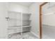 White shelving unit provides ample storage space in the garage at 4920 E Beryl Ave, Paradise Valley, AZ 85253