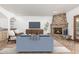 Living room features a brick fireplace and herringbone tile floors at 4920 E Beryl Ave, Paradise Valley, AZ 85253