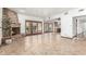 Living area with brick fireplace, herringbone floors, and backyard access at 4920 E Beryl Ave, Paradise Valley, AZ 85253