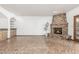 Living room with brick fireplace and herringbone tile floors at 4920 E Beryl Ave, Paradise Valley, AZ 85253