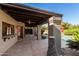 Covered patio with pool view and stone fire pit at 4920 E Beryl Ave, Paradise Valley, AZ 85253