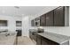 Kitchen features granite countertops and dark brown cabinetry at 5132 E Umber Rd, San Tan Valley, AZ 85143