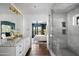 Elegant bathroom with marble shower, double vanity, and bedroom view at 5328 N 46Th St, Phoenix, AZ 85018